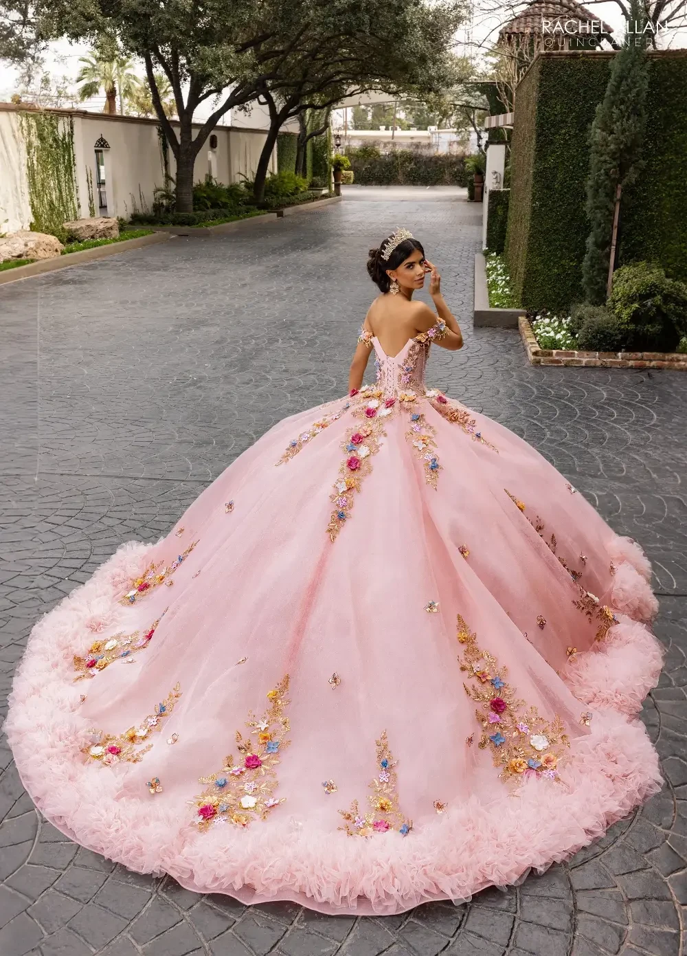 Model wearing a La Reina by Rachel Allan collection quince gown